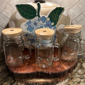 3 glass mugs with wooden tops. Has a hole for a straw. Never used. 🍺🍺